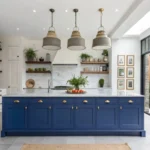 Blue kitchen decor with royal blue island and artistic shelving